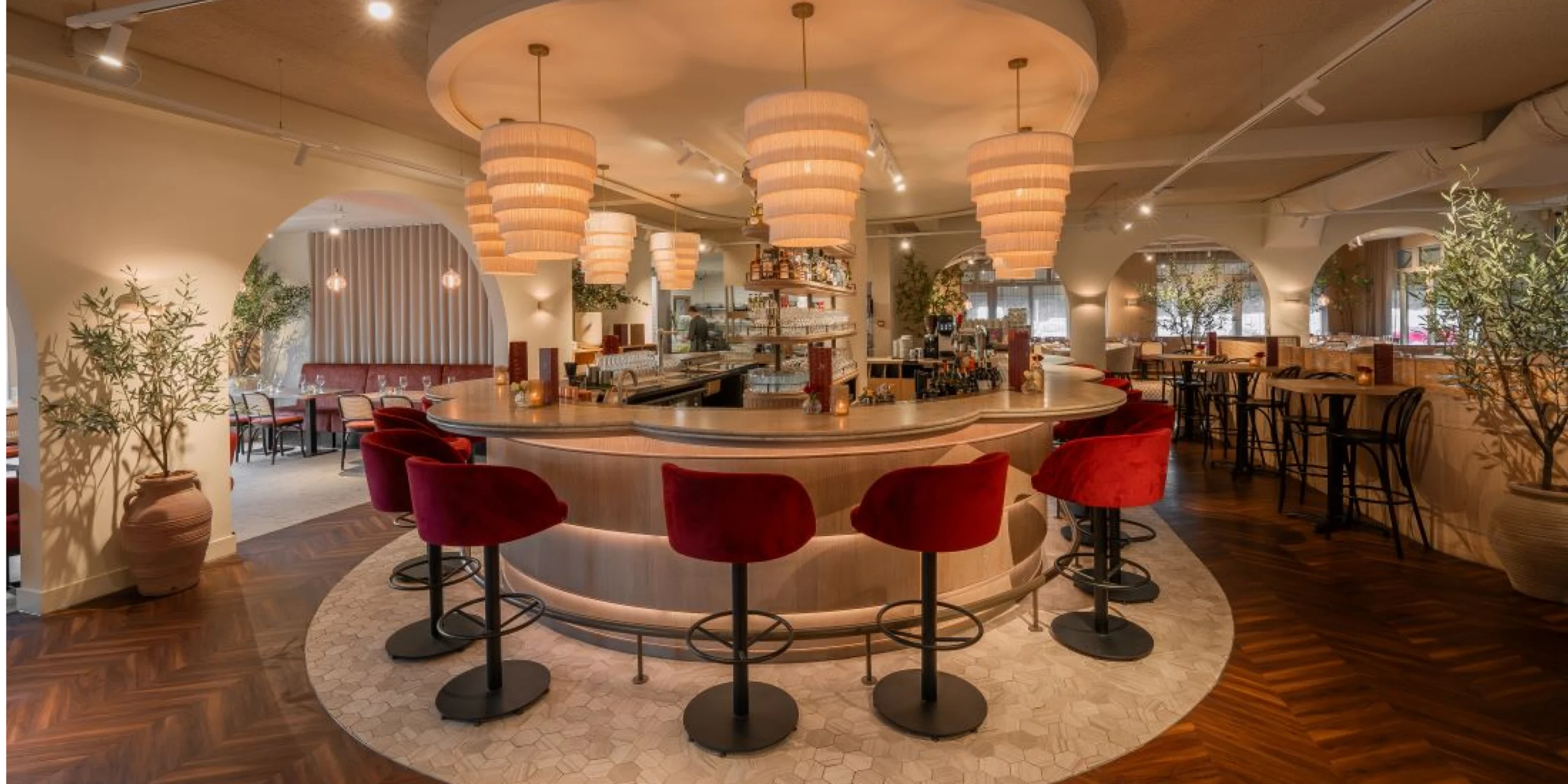 Warm and stylish restaurant bar interior with soft lighting and inviting seating.