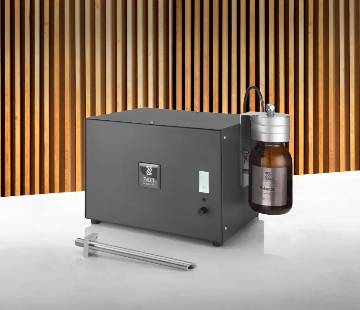 Zaluti HVAC scent machine with Mykonos fragrance bottle, designed for professional scent diffusion.